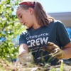 Crew student cleans up a campus garden