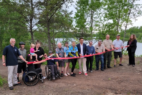 Ribbon cutting ceremony at bike trail head