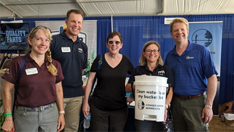 Holding a bucket reading clean water is on my bucket list