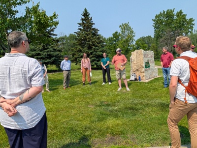 Group gathers by Seidls Lake Park sign