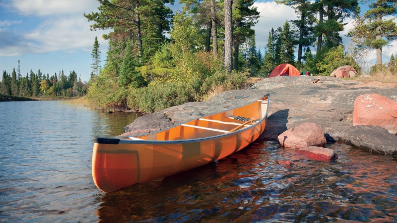 Canoe on the rocky shore of a campsite