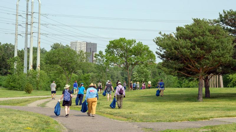 Clean-up crews walk through park