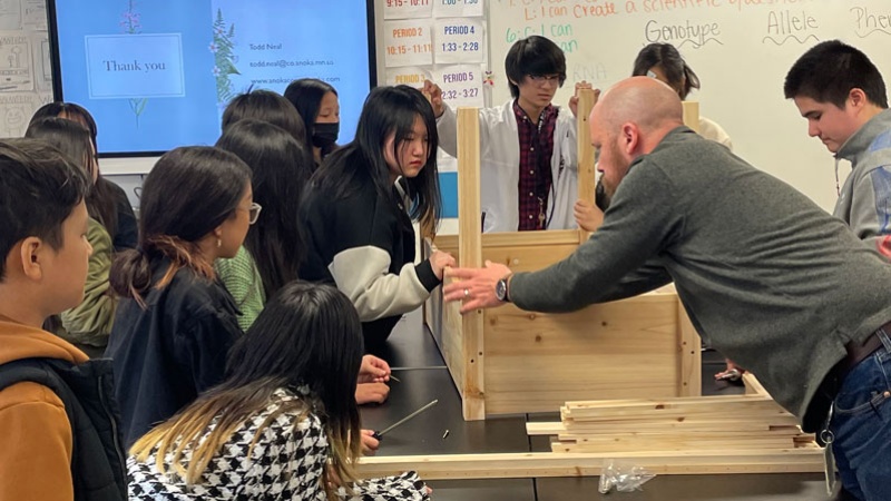 Students learn how to make a wood garden bed