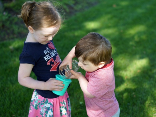 Kids with cups of water