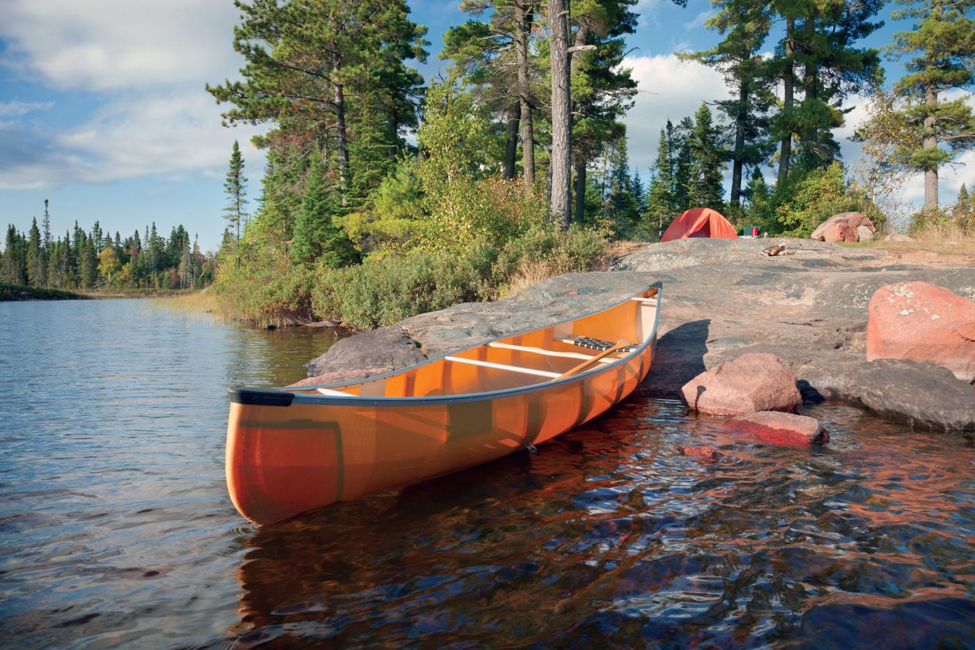 Canoe on the rocky shore of a campsite