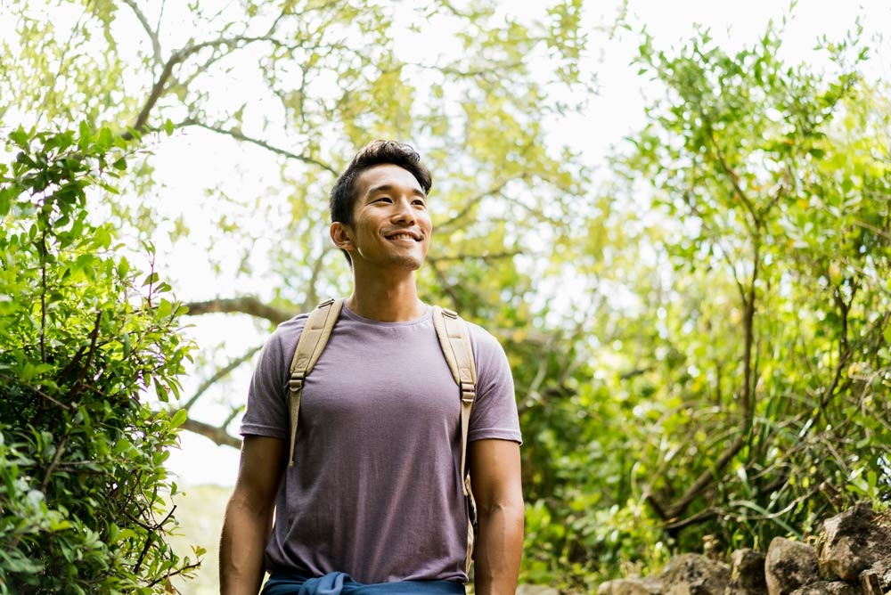 man hikes in springtime 