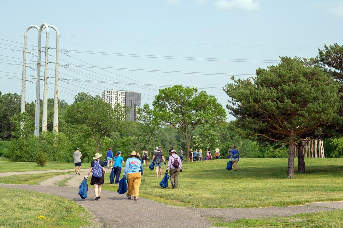 Clean-up crews walk through park