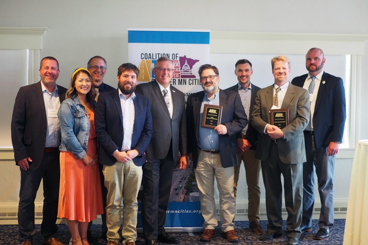 Group of people at the Coalition of Greater Minnesota Cities award ceremony