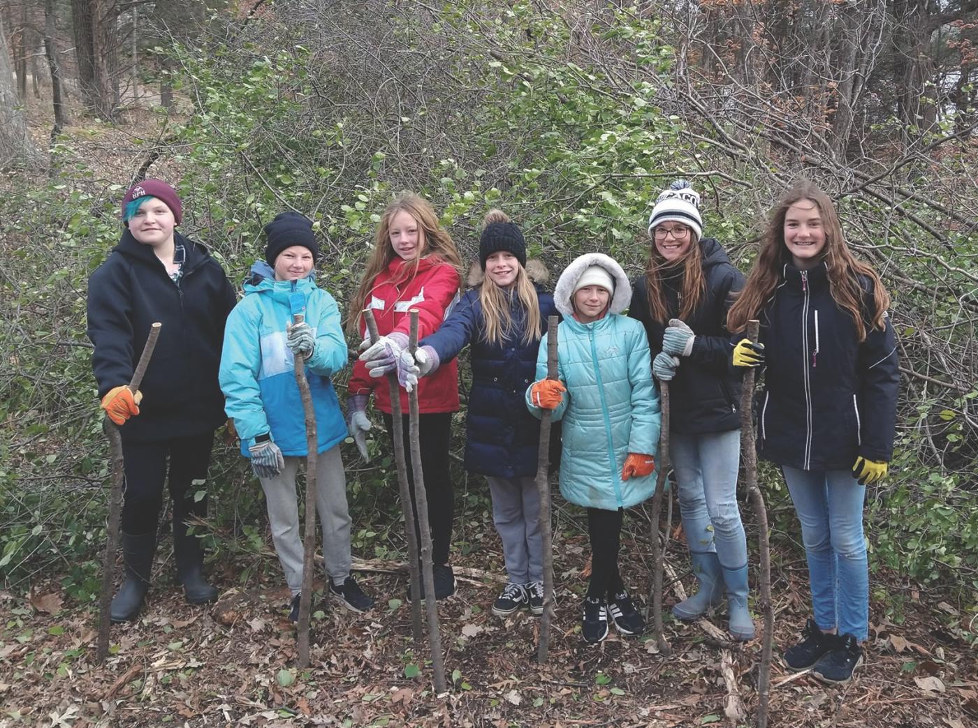 CC Students work on a buckthorn removal project