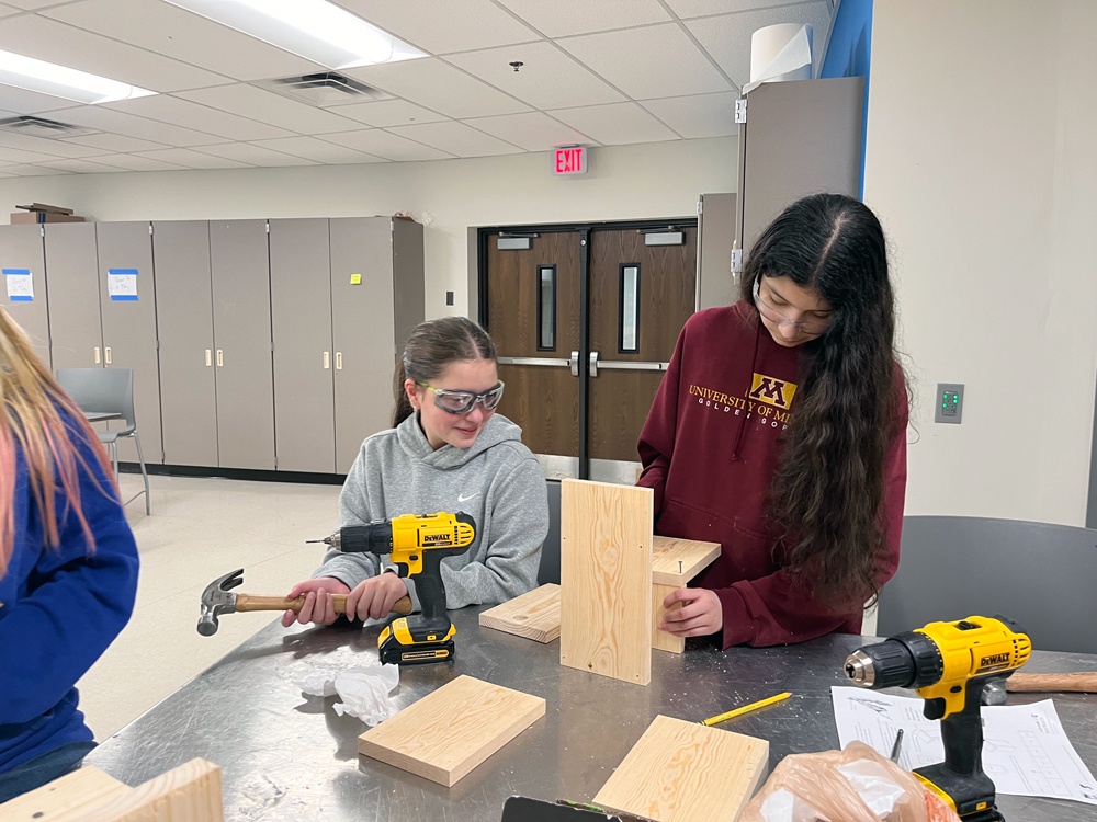 Students construct a wood birdhouse