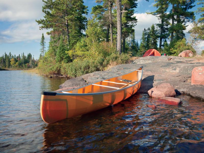 Canoe on the rocky shore of a campsite