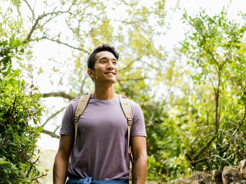 man hikes in springtime 