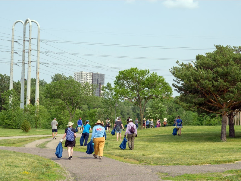 Clean-up crews walk through park