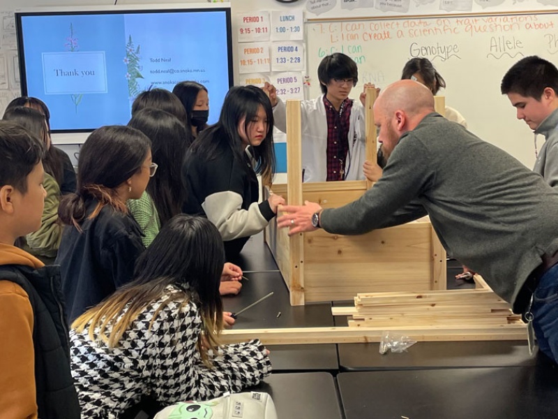 Students learn how to make a wood garden bed